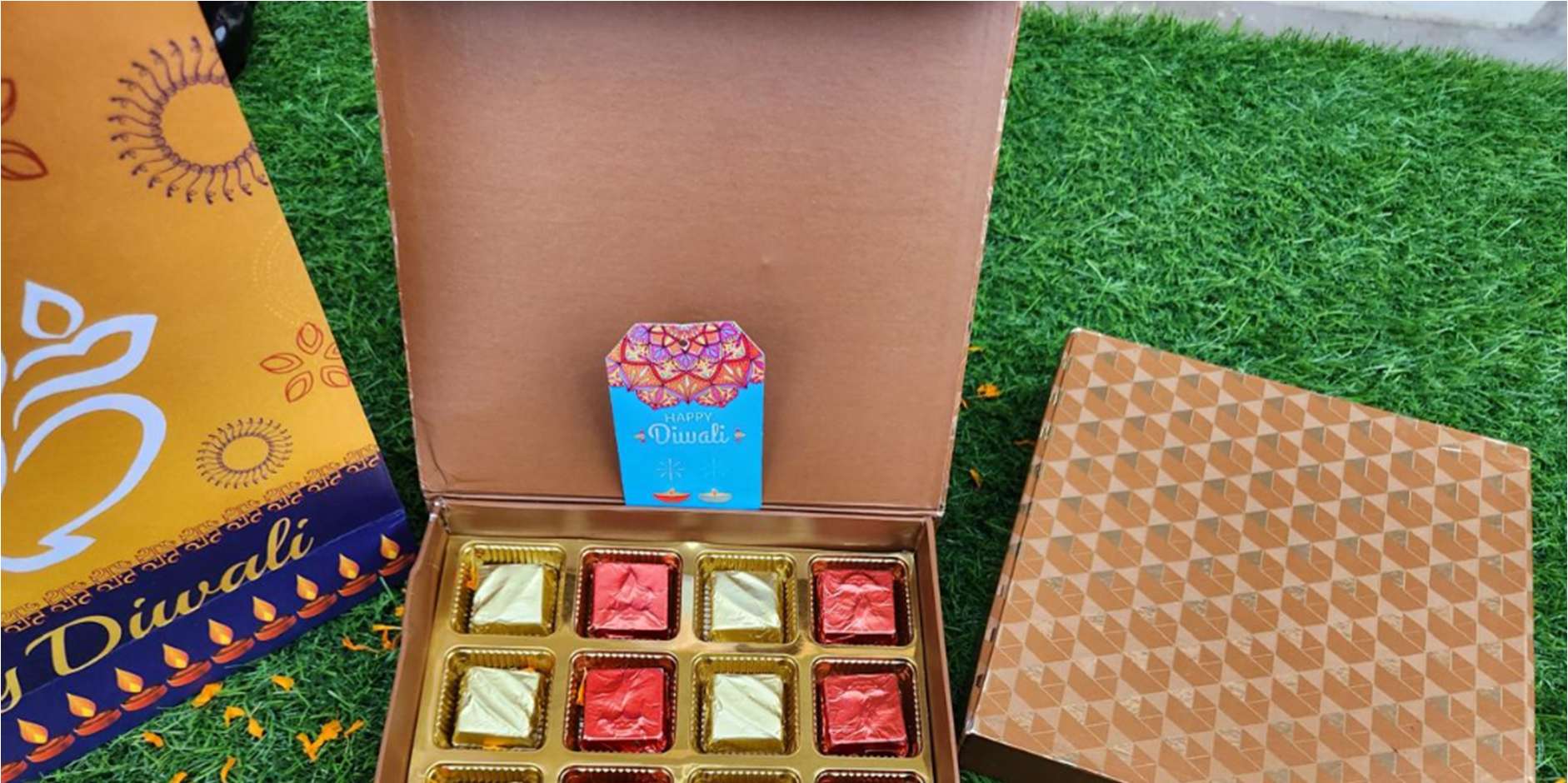 Copper Diwali chocolate box with 16 red and gold wrapped chocolates