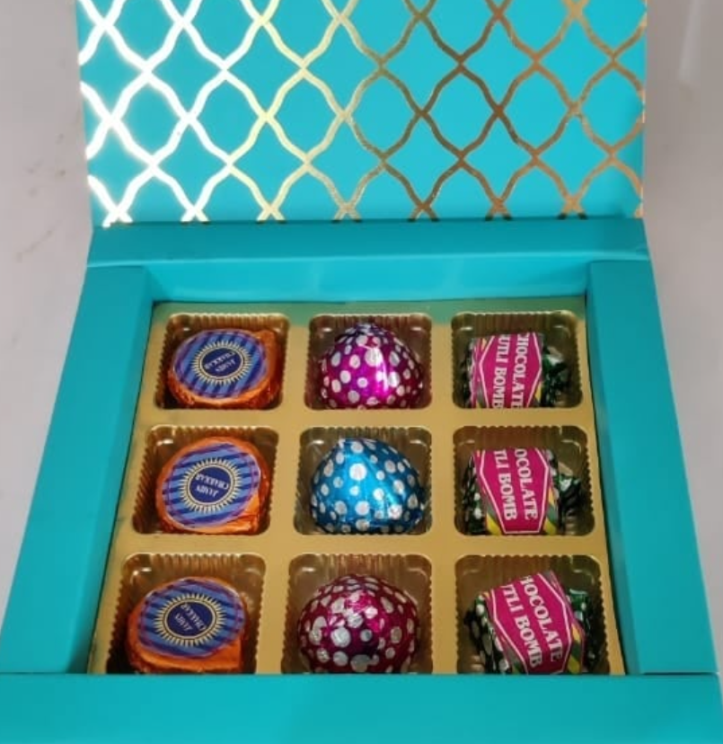 Premium teal and gold chocolate gift box with assorted handmade chocolates