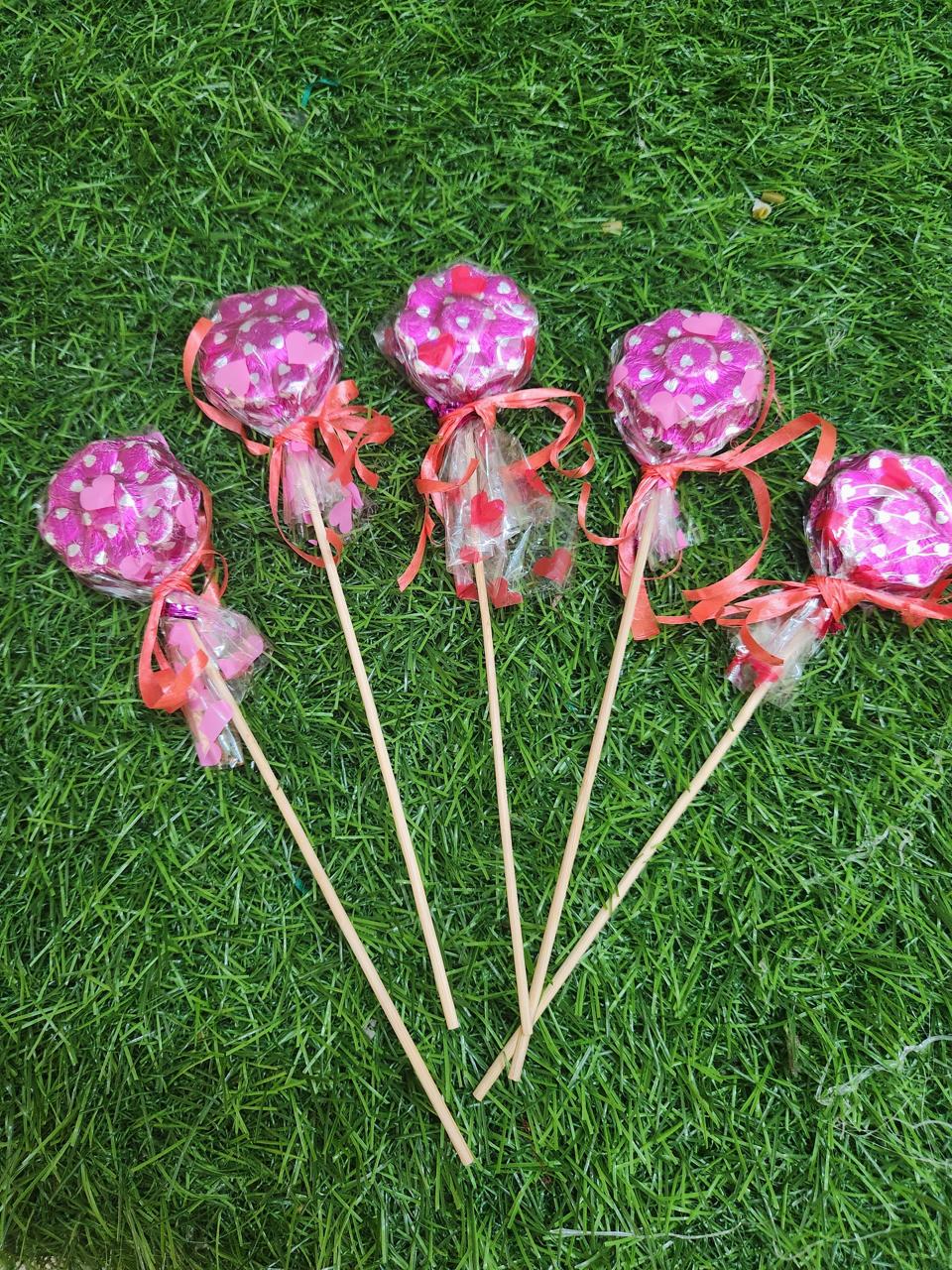 Pink foil chocolate lollipops for birthday parties and welcomes