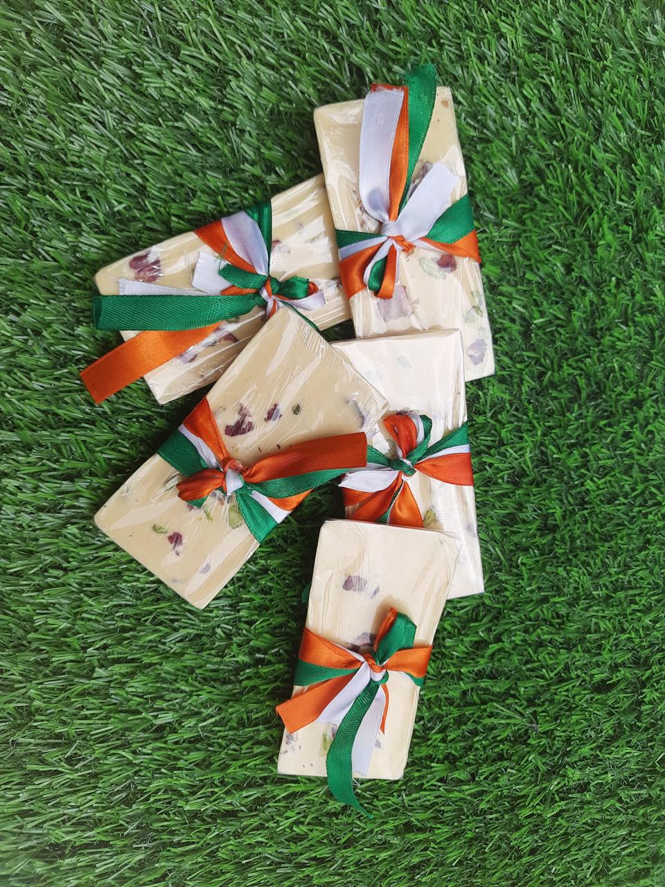 White chocolate fruit and nut bark bars tied with tricolor ribbons
